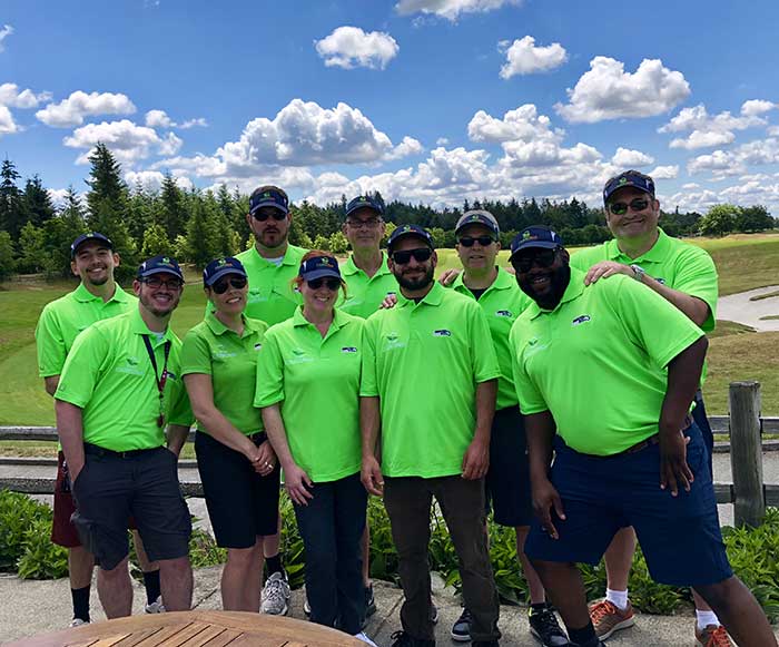 Crawl Pros team gathered at a golf course to take a team photo