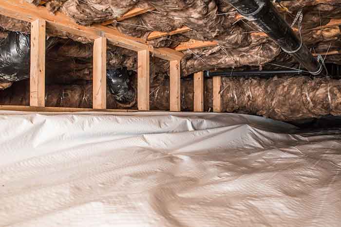 Crawl space with a vapor barrier installed to protect the area