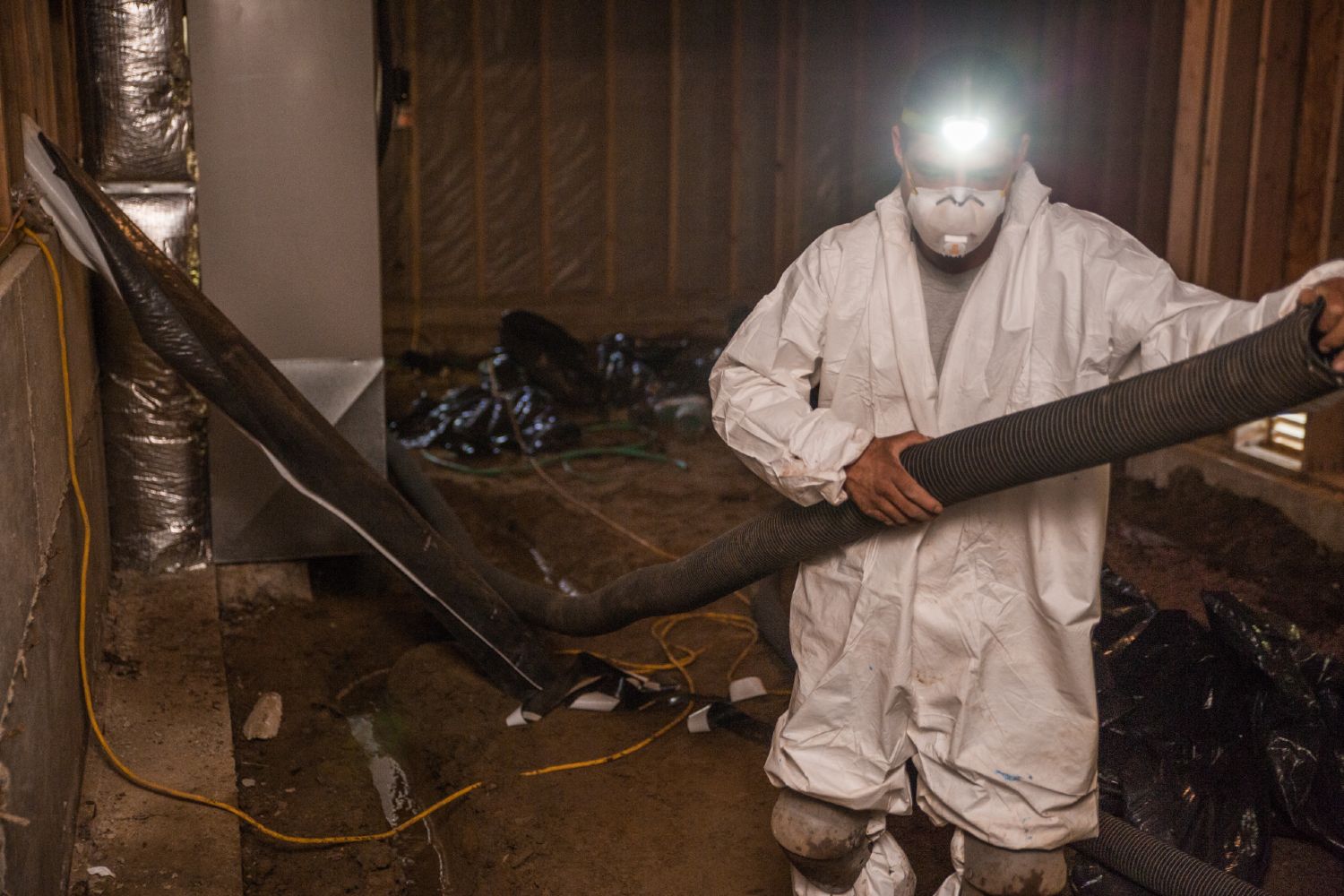 Crawl Pros professional preparing for a water remediation in a crawl space in Bellevue