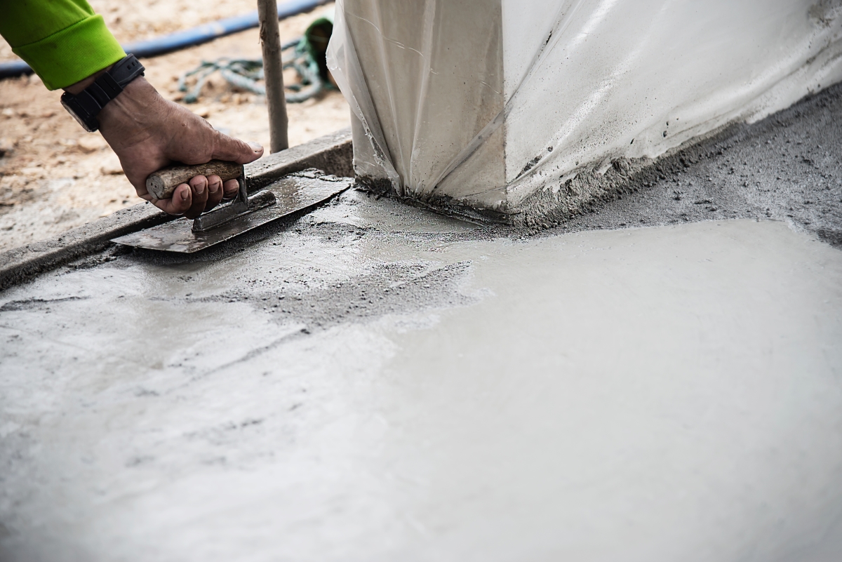 Construction worker paving cement